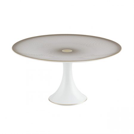 plat à mignardises en porcelaine de chez Raynaud avec un motif composé de fines ellipses noires et or et s'entrecroisent.